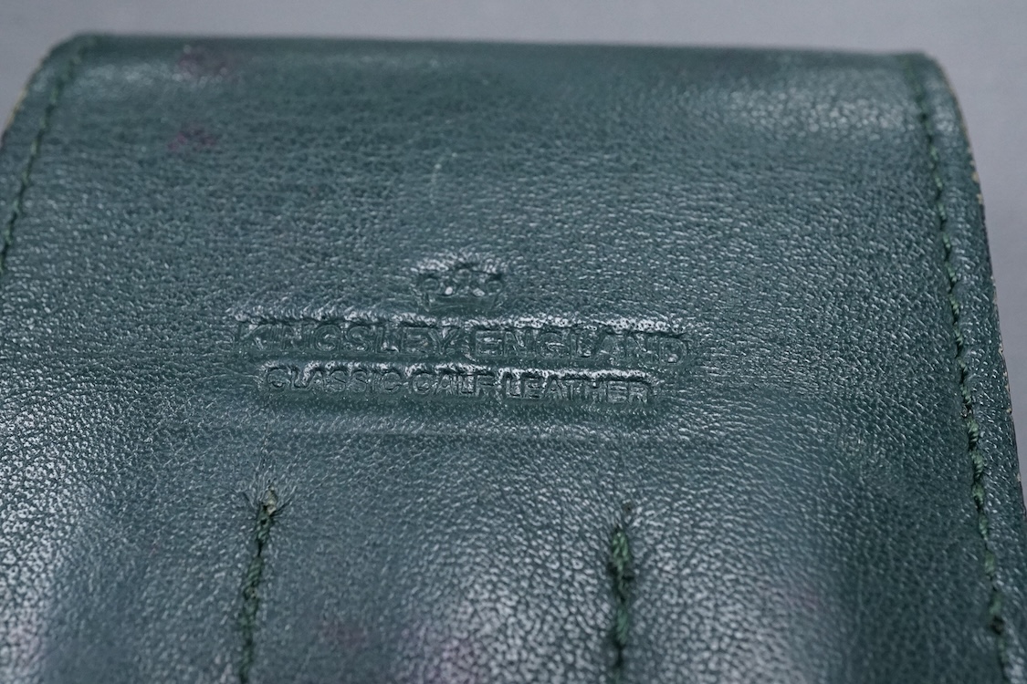 Three Mont Blanc pens in a green leather Mount Blanc case and two inkwells.